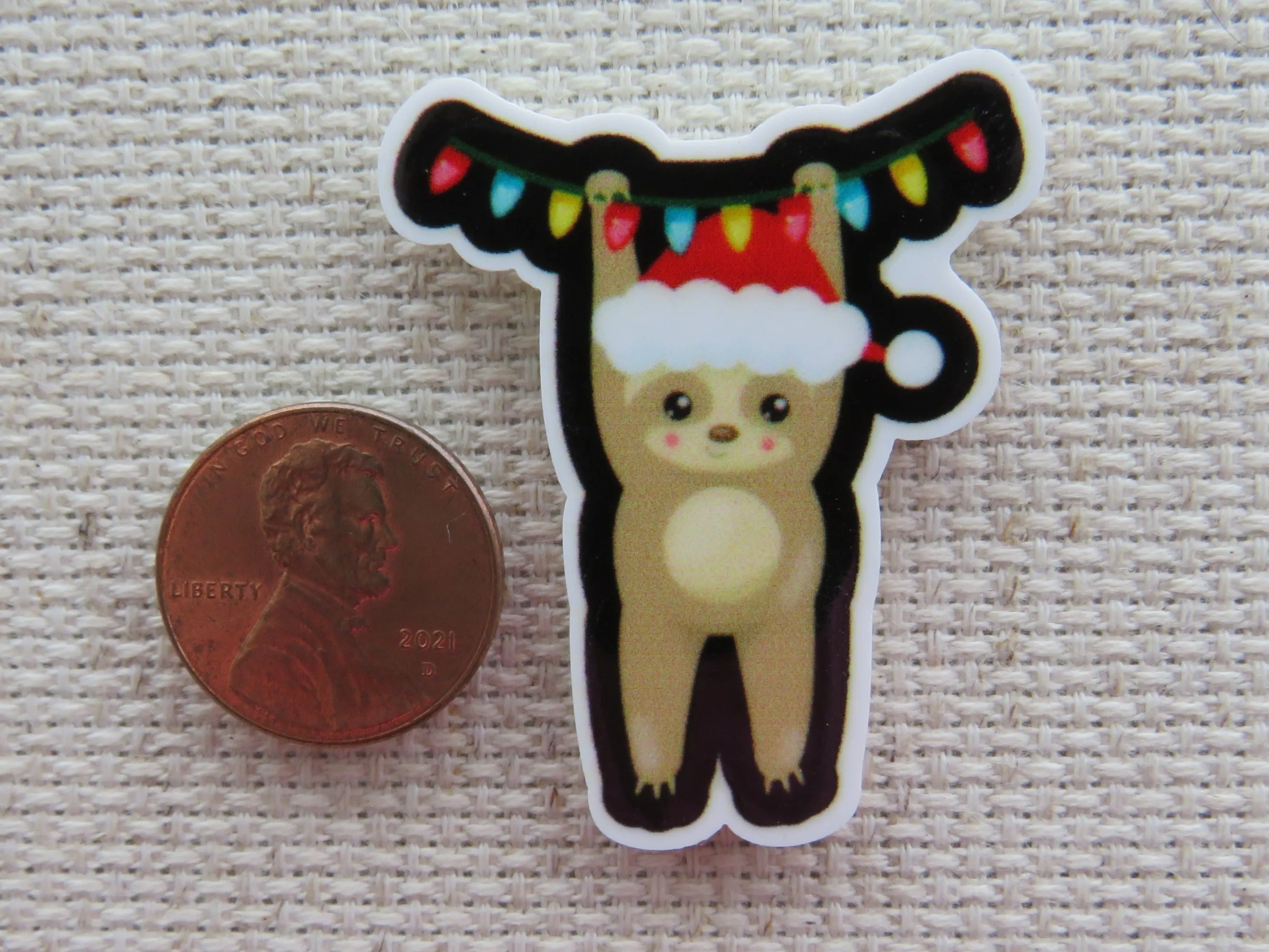 Christmas Sloth Hanging From a String of Lights Needle Minder, Cover Minder, Magnet